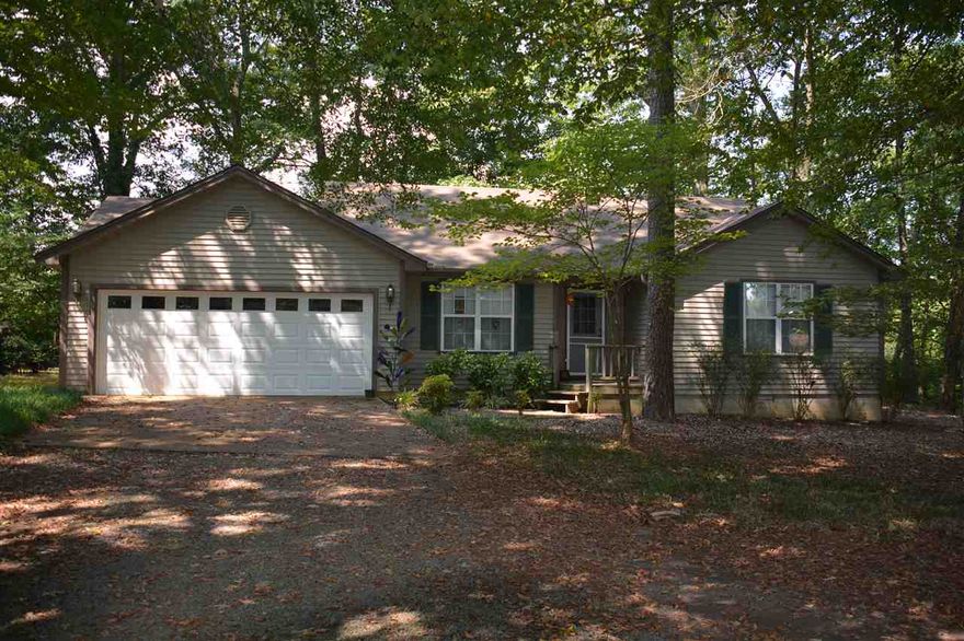 Well maintained, Custom built  river front home has room enough to be more than a weekender.  There's plenty of parking for your cars and boats in the 2 car garage. The back of the home features a large covered porch and the walk way to the river also has a sitting area overlooking the water. A great dock will accommodate your river boat. Come live on the Little Red!