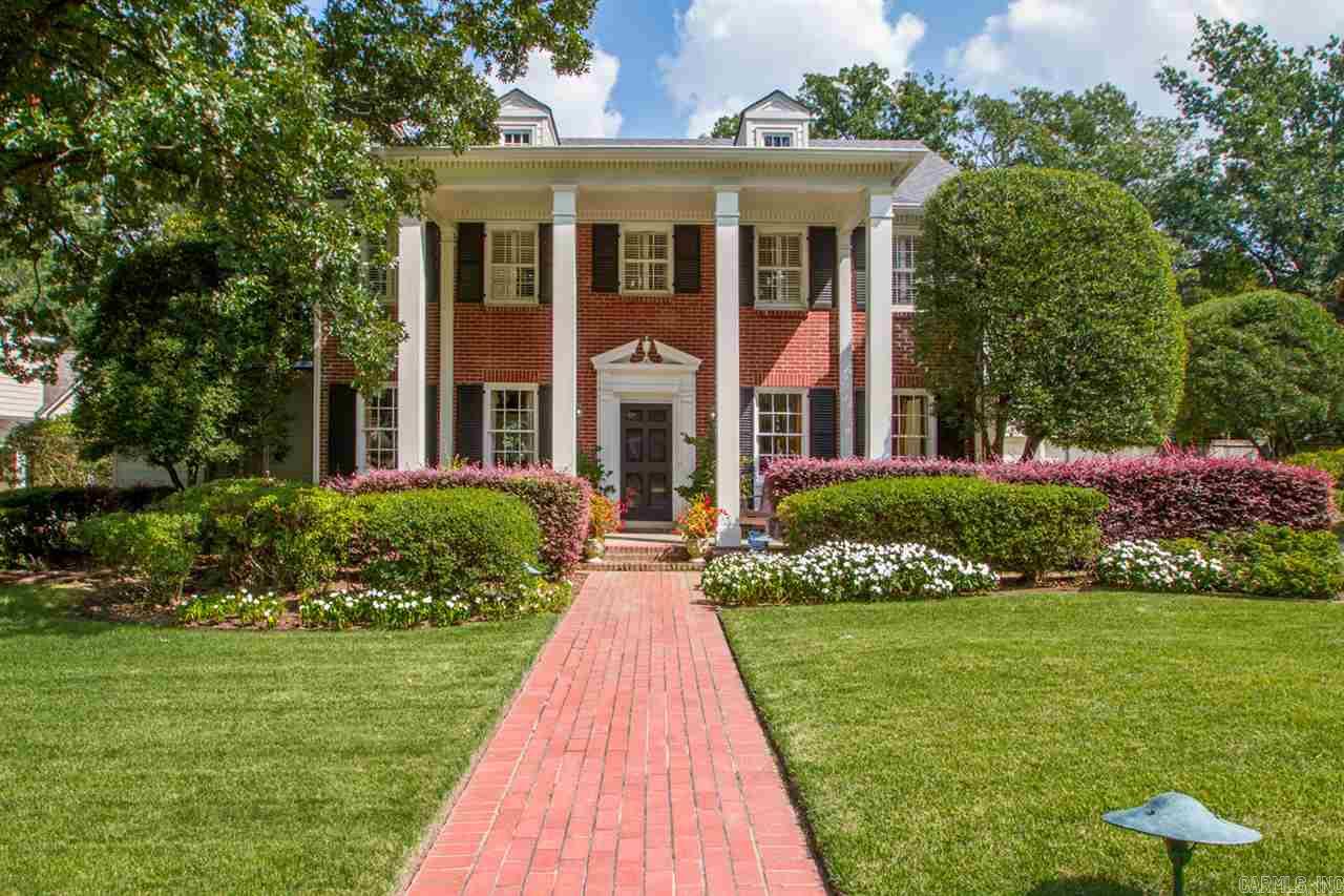 Spectacular Heights home on oversized lot!  Gorgeous street appeal and beautiful décor.  Exceptional floor plan w/Master suite up or down.  The perfect home for family living and entertaining friends. Fabulous formal dining, large family living room.  Updated kitchen flows into breakfast room and inviting hearth room with wall of windows overlooking rear terrace and landscaped lawn. Large bedroom suite on main level. Upstairs: 3 Large additional bedrms and 2 full baths. Sep. quest quarters above two car gar
