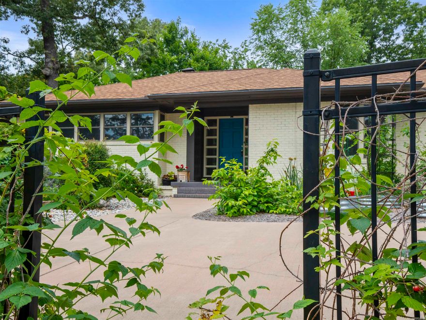 What a house! Mid Century Modern with quality renovations on a desirable Street in Uptown. Nature abounds in this space (.83 acre). Gardeners will love the gardening shed and greenhouse to accommodate the mature gardens this seller has put in. Back deck placed in the middle to view the gardens and watch the birds. Seller has downsized, the love for the home shows through. Dynamite kitchen with view windows and huge working Island. Built in's in dining room and office bedroom. Double sided fireplace from living room to dining room. ALL NEW WINDOWS 2025. Roof replaced 2024. This is a beauty, don't miss!