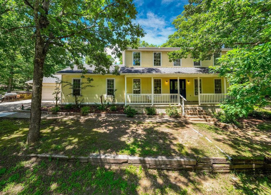 Outstanding custom built, two story traditional located on beautiful 5 wooded acres.  Fabulous private setting for family living and entertaining. Handsome street appeal with large and inviting front porch. Excellent floor plan and numerous recent updates! Handsome entry and pretty decor'. Fantastic newly updated kitchen and dining, wonderful great room with fireplace, built-in's and French doors that open to large sun terrace. Spacious primary suite on the main level. Upstairs: four large bedrooms and two full baths. Two car garage. Additional storage.