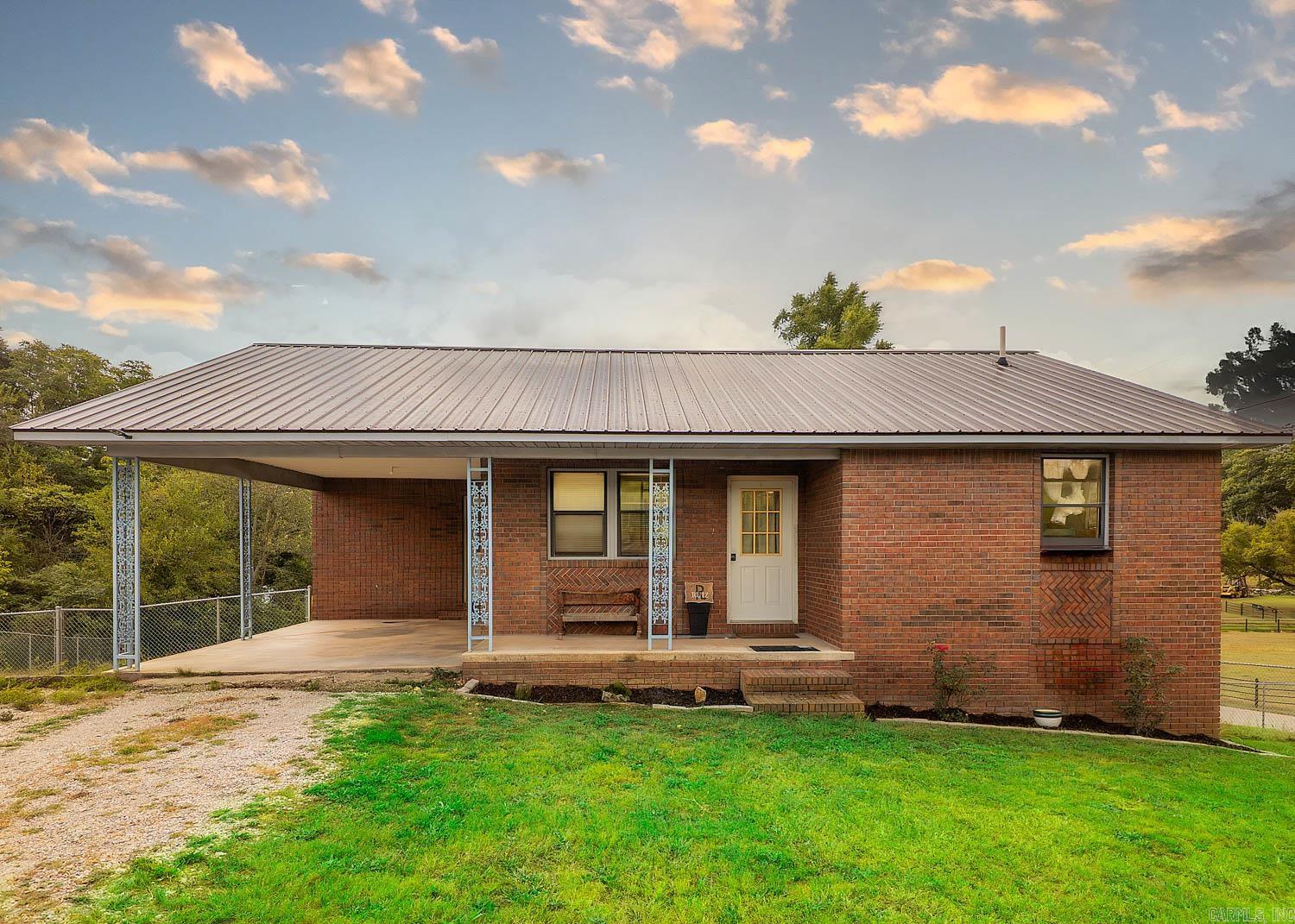 Small-Town Home Near Spring River Nestled in the Arkansas Ozarks, this 2-bed, 2-bath brick home offers comfort, convenience, and potential. Located on a quiet street with few neighbors, itās under a mile from Spring River and Mammoth Spring State Park, where fishing, kayaking, and scenic walks await. The open-concept design creates a spacious feel for everyday living and entertaining. The kitchen features granite countertops and flows into the living and dining areas. The master suite includes access to a balcony-style back porch overlooking the large fenced backyard. Practical upgrades include central HVAC, a metal roof, and a carport for easy parking. The basement provides untapped potential, easily allowing conversion into a 3rd bedroom, hobby area, or extra living space. Offering small-town living with modern comfort, this home is a rare find near one of the Ozarksā most beautiful natural settings.