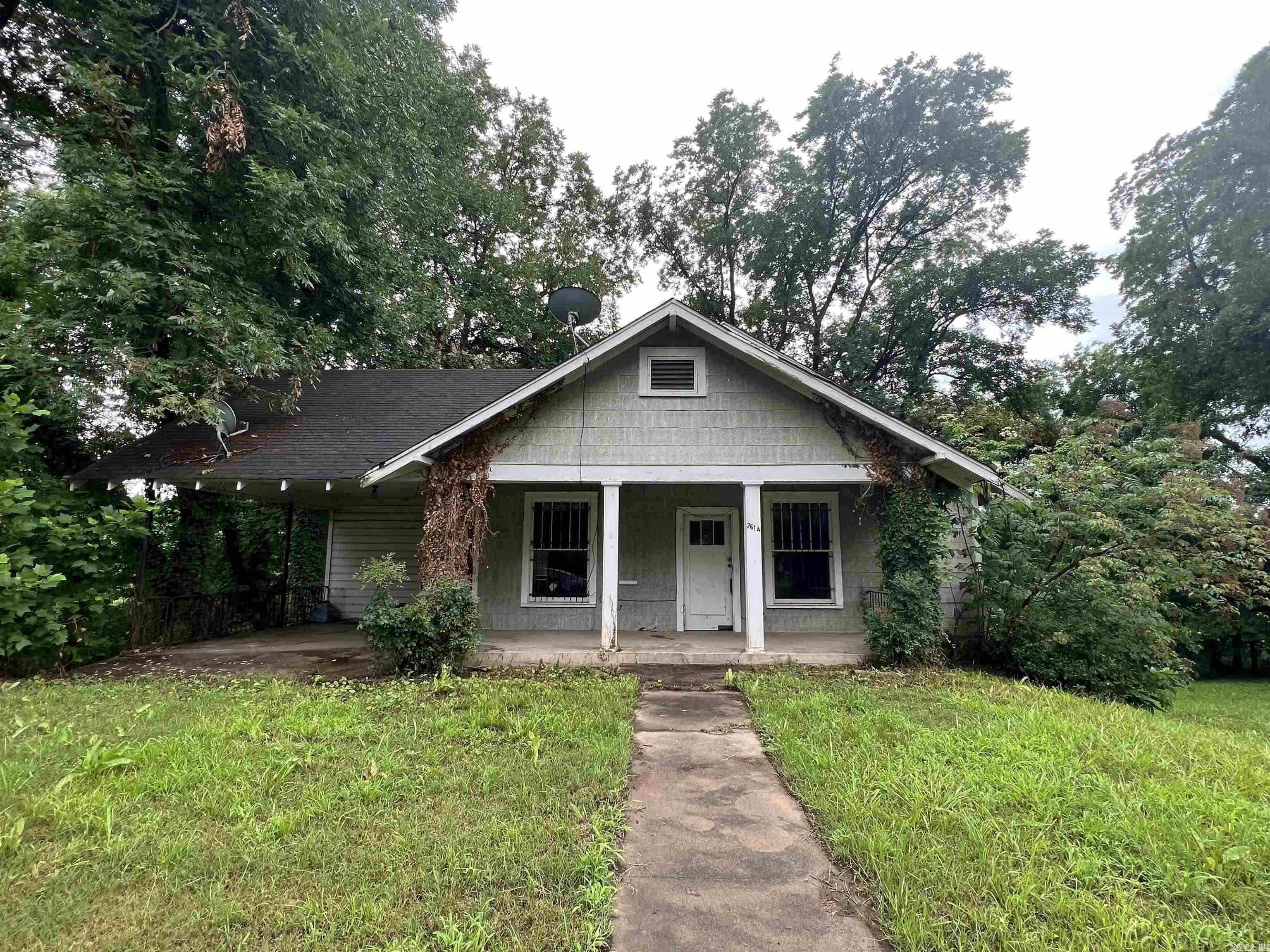 This is a Great Investment Opportunity! Large residential lot, 1.25 +/- acreage. It is zoned for Residential and Multi-Family! Build a new Home or Duplex/Triplex on this property or possibly renovate existing house. Or both! There is enough space on this acreage to build multiple housing units. The existing house needs a lot of work to Renovate. No utilities are on and will not be turned on, due to the shape the house is in. This property is being sold "as is". No repairs. Agents, see Agent Remarks. New Survey shows 1.25 +/- acres. SF is approximate.