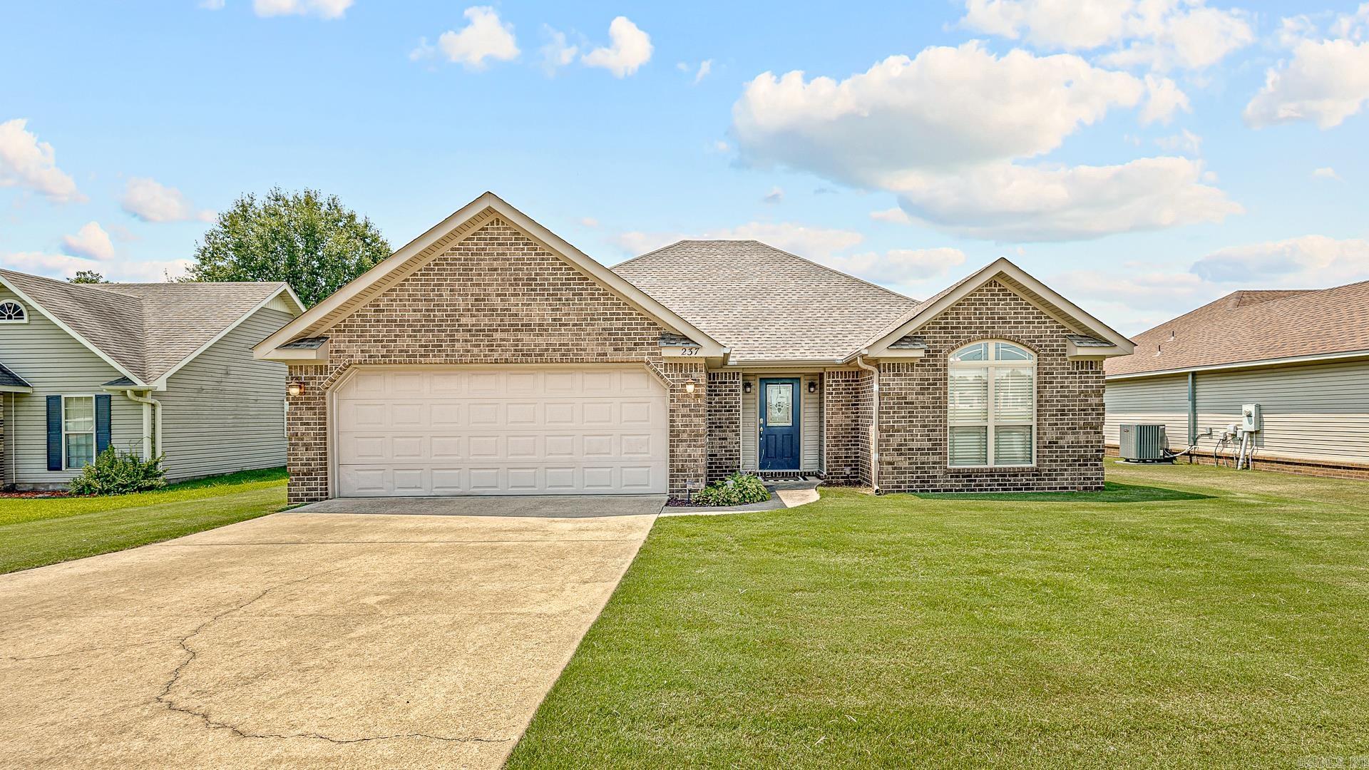 Welcome to Market 237 N. Oak St. of the Honeysuckle Heights Addition of Brookland, AR within the Brookland School District. This 3 bedroom, 2 bathroom brick and vinyl siding ranch home comes with a built in surround system throughout along with the back porch, which also has a mounted tv. When entering the welcoming foyer from the front door, you notice the beautiful living room at it's center. Two guest bedrooms and a guest bathroom to the right, will offer convenience and privacy being separated from the main bedroom. Walking through the living room, on the back right will take you to the large owner's suite with a beautiful window for amazing natural lighting, an en-suite with dual vanity, oversized jet tub, walk-in closet, and stand alone shower. Outside, you will have a large fenced in yard for all of your needs. This home is within walking distance to the schools being across the street from 2 of them, 5.2 miles from NEA Baptist Hospital in Jonesboro, 12 miles from Paragould, and only one street away from HWY 49. This home has it all. Call today to make this house your home!