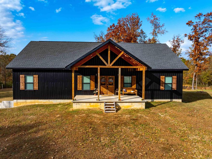 Welcome to the market! This beautifully designed custom-built home, completed in 2022, offers modern elegance and comfortable living just minutes from the heart of Cave City. This 3-bedroom home showcases a spacious main-level master suite with a luxurious bathroom that includes a large soaking tub and a tile walk-in shower. The two additional bedrooms and the 2nd bathroom on the opposite side of the home are ideal for family or guests, providing a sense of privacy and space. The open-concept living room and kitchen create a welcoming atmosphere as you step in through the front door, perfect for gatherings and entertaining. An additional bonus room upstairs can serve as a fourth bedroom or a convenient home office. The full, unfinished basement, already plumbed for an additional bathroom, offers endless possibilities for customization to suit your needs. A one-car garage attached to the basement provides easy access and additional storage. Step outside onto the full-length covered back porch to enjoy serene views of the spacious 3-acre (+/-) yard—a peaceful retreat with room to roam. This home does have fiber internet and less than a mile of gravel road to reach the driveway.