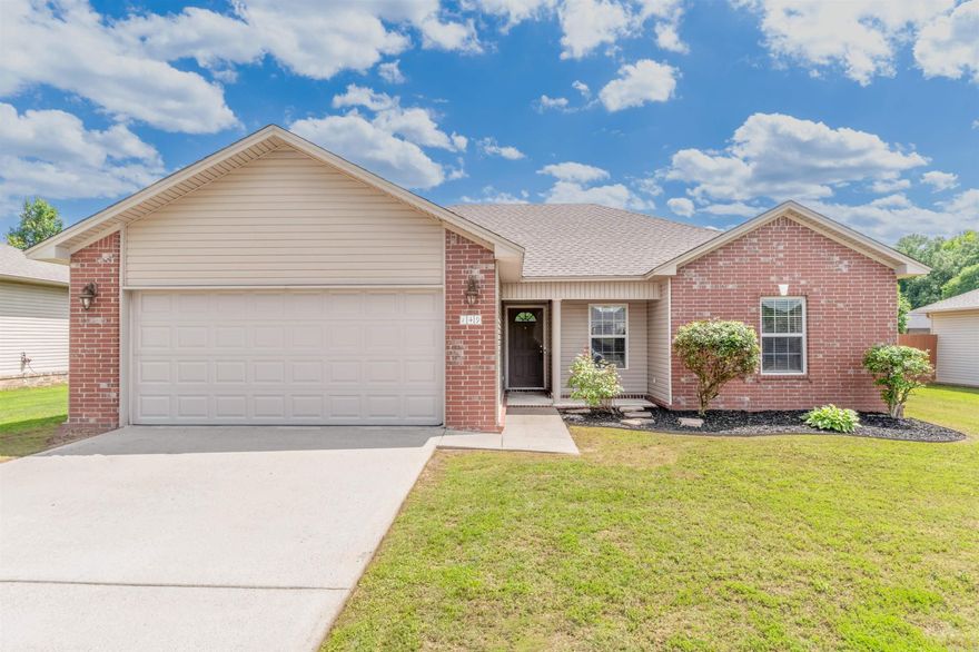 MOVE IN READY! This 3 Bedroom, 2 Bath home is ready for a new homeowner! The vaulted Great Room, with an open concept design and primary bedroom split apart makes this a desirable floor plan for both owners and guests! This home is loaded with improvements: NEW luxury vinyl flooring throughout, NEW AC unit, and NEW farmhouse sink! NEWER improvements include Roof 22', hot water heater, and microwave! Stainless steel refrigerator is included! The extended & covered patio overlooks the level backyard complete with new/newer wood, privacy fence! Plus, this home is conveniently located to freeway access! Call today for a showing! Agents see remarks.