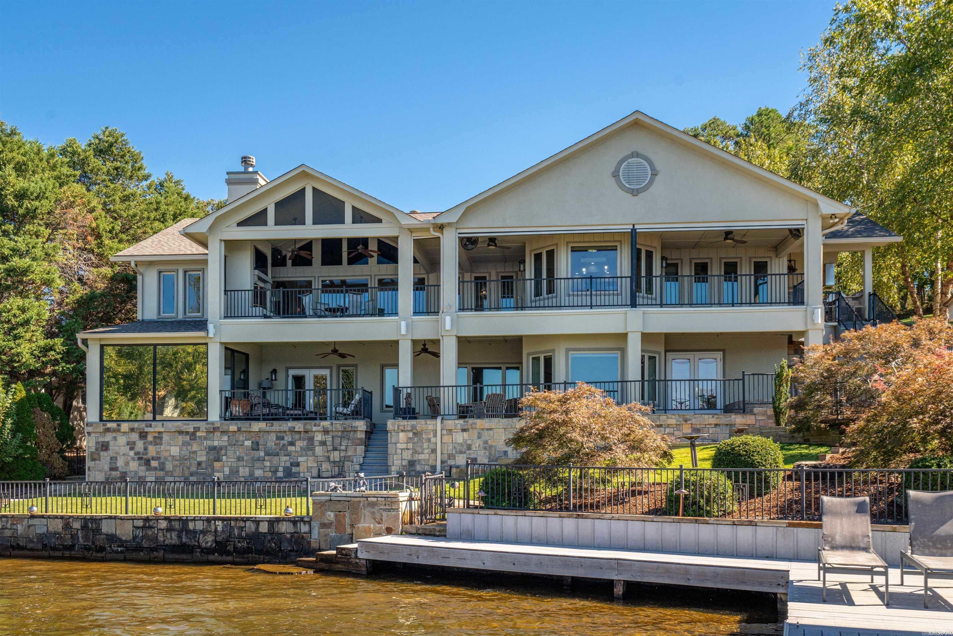 If you want luxury and lake...look no further! Gorgeous 4615 sq ft home on Lake Hamilton with absolutely breathtaking views from most rooms. This home has been remodeled with no expense spared! Located within the security of a gated subdivision. Entertain guests in style w/outdoor kitchen, fireplace & covered patio. Retractable sunscreen and protected with a mosquito misting system. 2 stories with plenty of room to entertain family & guests. Study/Home office. Living area and Dining area on each level. Exercise room and Bar with Kitchenette on lower level. 2 covered dock slips each with a lift. Homes offered in Driftwood never last long on the market. Don't let this one slip away. Make your showing appointment today to see how much this amazing property has to offer!