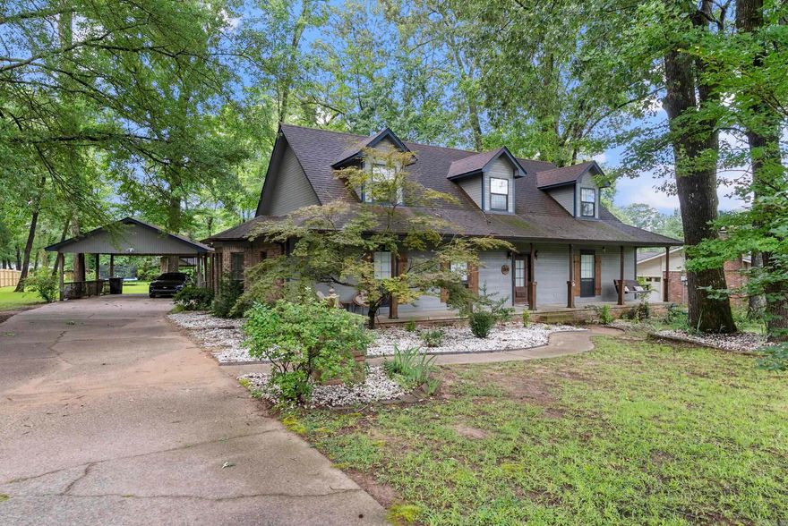 Welcome Home to Charm and Comfort! Nestled in the heart of the city but offering a serene country feel, this home is a true gem. You're greeted by a welcoming front porch. Inside, there's a massive kitchen with abundant cabinet storage, a spacious island, and a bar area providing additional seating-ideal for entertaining! The living space is flooded with natural light from large accent windows, perfectly framing the room's centerpiece: a stunning floor-to-ceiling brick fireplace. This home boasts plenty of extra space to fit your lifestyle. From the upstairs loft to the downstairs office and den, there's room for work, play, and relaxation. Outdoors, you'll appreciate the natural privacy, wooded backyard, and ample storage with two sheds. All appliances convey. Plus, there's an extra carport area ready to accommodate a boat or trailer. Conveniently located just 5 minutes from LRAF base, 1 minute from Jacksonville PD, and with quick highway access, this home offers both tranquility and accessibility. Fall in love with a home that blends charm, functionality, and location-schedule your showing today!