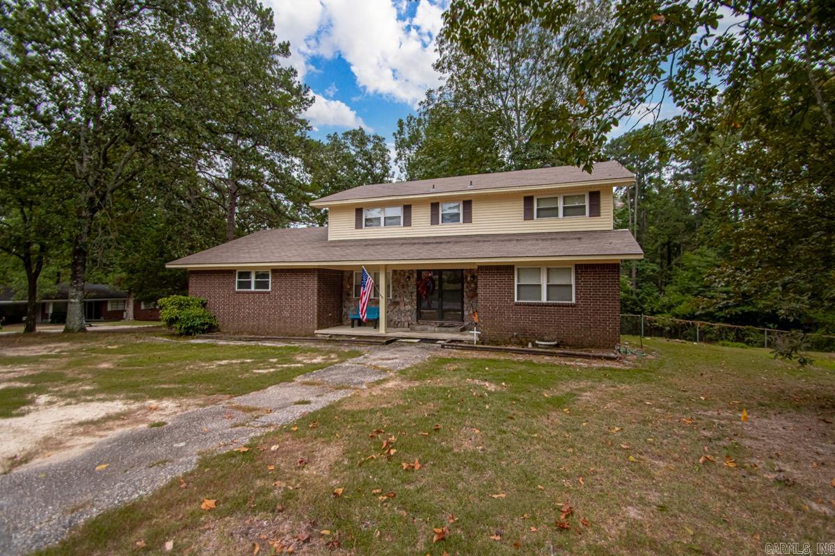 Spacious 3 bedroom, 2.5 bath home on 1.88-acre corner lot in the desirable Magnet Cove School District. This Property features a large fenced backyard, perfect for pets and outdoor activities, and an inviting covered back porch for relaxing or entertaining. Inside you will find a private office that could also serve as a dining room, a cozy den with fireplace, and a formal living area. The home offers a generous laundry space and plenty of room for comfortable living. Garage door installed in January 2025. Stove and Dishwasher installed 2012 & Microwave and Refrigerator 2023. Kitchen has Pantry closet as well as built in Pantry for tall items plus build in utility/coffee bar. New Electrical box 2022. Conveniently located just 2 minutes from I-30 and 15 minutes from Hot Spring National Park. SEE AGENT REMARKS