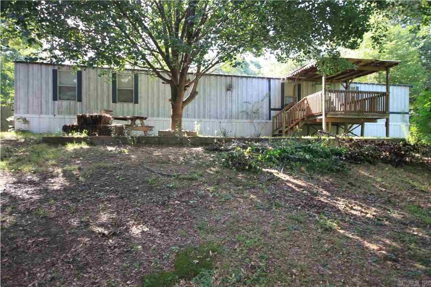 Nice single wide mobile home on a little more than an acre of land. Nice front covered deck. Open floor plan with laminate wood flooring in the great room. Large open kitchen with an island and dining area. Large master suite with a nice soaking tub. Covered rear deck. Large shop with roll up door and lean-to on one side. Storage building in backyard. Above ground pool.