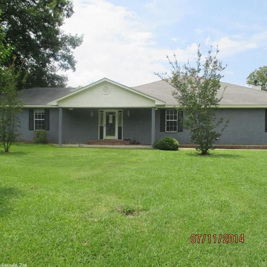 This large brick home sits on 5.12 acres.  This home has 2 living areas, huge kitchen with lots of cabinets, split floor plan.  Office or nursery could be used as 4th bedroom.  Two outside storage/shop buildings, partially fenced with a pond.  List date 10/8/2014 This home is being sold "AS IS".  **AGENTS SEE REMARKS**