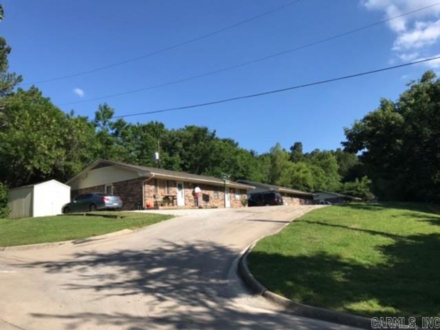 *Investment Property New To Market*  8 units (4 duplexes) minutes away from U of A in Fayetteville, AR* Situated on 1.53 acres which includes extra land for developing additional rental units* Zoned RMF-24 which means up to 24 units total are allowed per acre on this property* Current rental income is $60,540/year* Most tenants are long term along with U of A student rental* Property owner has moved from area.