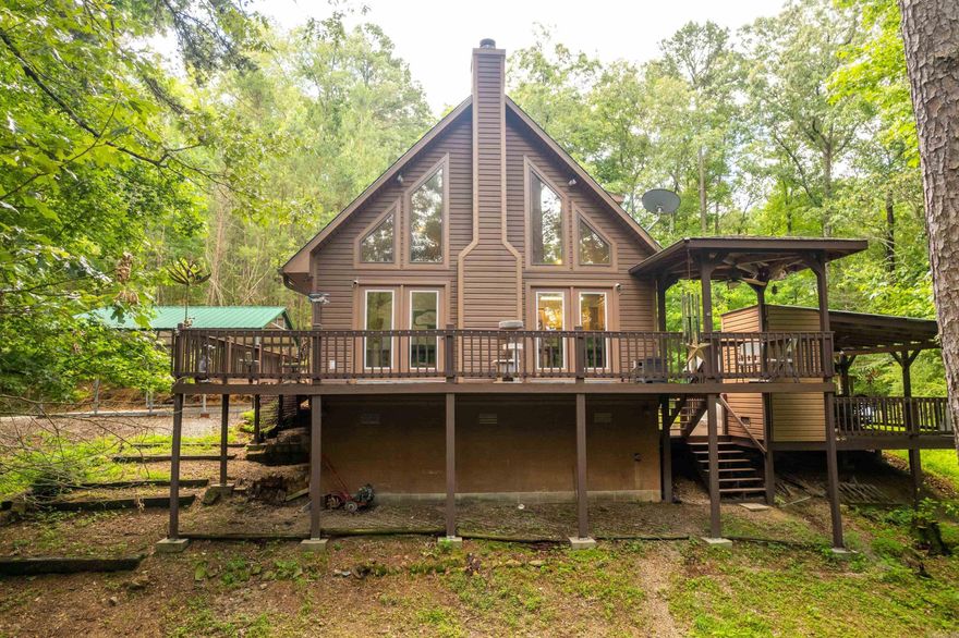 A charming, mid-2000s-built home nestled on nearly 10.5 acres in a quiet, rural-suburban setting in a gated community. It features modern comforts with new carpet, laminate flooring, tile counter tops, and new hvac system in 2024. All electric, well, whole home generator that runs on propane. Bonus room used as an office but could be extra storage, or mancave. Wood burning fireplace makes it cozy on those cold winter nights.Generous outdoor space with a freshly painted back deck to enjoy your morning coffee and nature. Private, secluded, mostly wooded with beautiful large shade trees. Outside storage building with a nice carport for 2 cars. About 10 minutes to the bypass which makes it convenient to all amenities in Hot Springs. Fountain Lake Schools!