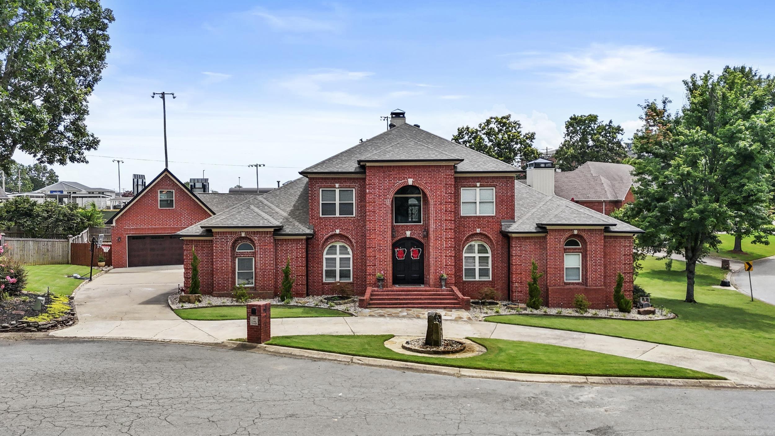 Stunning remodeled property on a corner lot in a quiet cul-de-sac in the heart of North Little Rock! This 5 bed, 4.5 bath home features an incredible new addition known as The Club House ā offering an extra 2-car heated/cooled garage, playroom w/ kitchenette, half bath, upstairs bonus room, and a gorgeous covered patio w/ outdoor kitchen and fireplace. Step inside through new iron double doors to a dramatic foyer and dining area. Office off the foyer. New roof, floors, fixtures, stone work, plantation shutters, and paint throughout. Open eat-in kitchen boasts large family island, fireplace, abundant cabinetry, granite ctops, ice maker, wine fridge, new appliances, plus 2 pantries. Large family room with abundance of natural light and a floor-to-ceiling stone fireplace. Main-level primary suite with stone double-sided fireplace, sitting area, luxurious bath w/ double shower, jacuzzi tub, and walk-through closet. Laundry Room (w/ laundry chute), guest bed and bath also on main level. Upstairs: 3 beds, 2 baths. Private covered patio off kitchen. Exterior has all new new landscaping and automated lighting. Sprinkle system. Added bonus - Cat 5 wiring throughout! Setup a showing today!