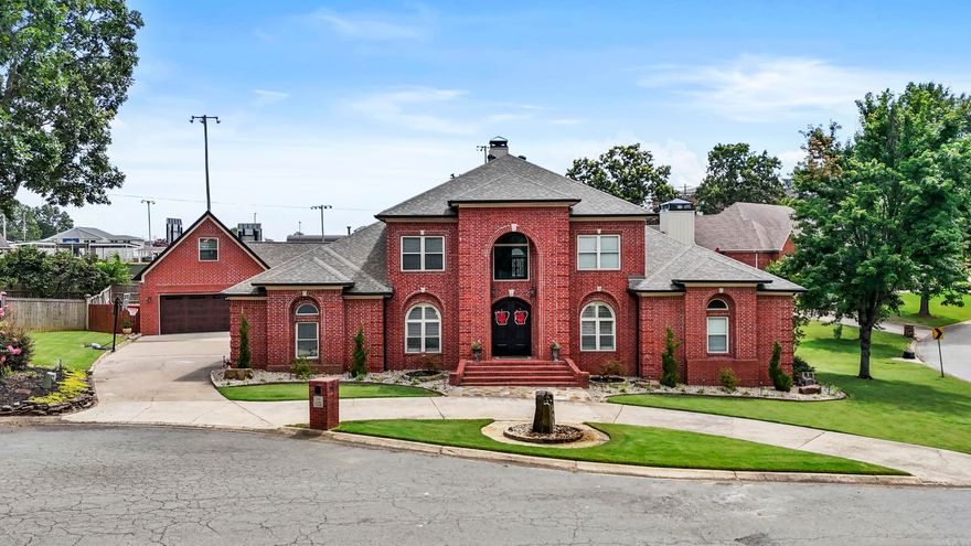 Stunning remodeled property on a corner lot in a quiet cul-de-sac in the heart of North Little Rock! This 5 bed, 4.5 bath home features an incredible new addition known as The Club House — offering an extra 2-car heated/cooled garage, playroom w/ kitchenette, half bath, upstairs bonus room, and a gorgeous covered patio w/ outdoor kitchen and fireplace. Step inside through new iron double doors to a dramatic foyer and dining area. Office off the foyer. New roof, floors, fixtures, stone work, plantation shutters, and paint throughout. Open eat-in kitchen boasts large family island, fireplace, abundant cabinetry, granite ctops, ice maker, wine fridge, new appliances, plus 2 pantries. Large family room with abundance of natural light and a floor-to-ceiling stone fireplace. Main-level primary suite with stone double-sided fireplace, sitting area, luxurious bath w/ double shower, jacuzzi tub, and walk-through closet. Laundry Room (w/ laundry chute), guest bed and bath also on main level. Upstairs: 3 beds, 2 baths. Private covered patio off kitchen. Exterior has all new new landscaping and automated lighting. Sprinkle system. Added bonus - Cat 5 wiring throughout! Setup a showing today!