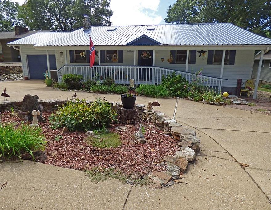 Looking for a beautiful lake home where peaceful living and lake side fun come together??  Tucked along the shoreline of gorgeous Lake Sequoyah this home offers the setting where people come to live and enjoy.   Inside you will find a fully furnished comfortable open design concept with a large kitchen/living and dining room that is fully open to the covered deck area making it the perfect space to entertain, or sip your morning coffee.  The 3  bedrooms will accommodate full time living, weekend getaways or would make this home a perfect nightly rental opportunity for any investor.  If that's not enough there is an extra bunk room inside the house, and the perfect bonus space off of the garage that can be used to create an additional sleeping space, game room, shop area, office etc!     Located in a community known for it's natural beauty, rivers, golf courses and laid back life style this could be just what you are looking for!    Call for your tour today.