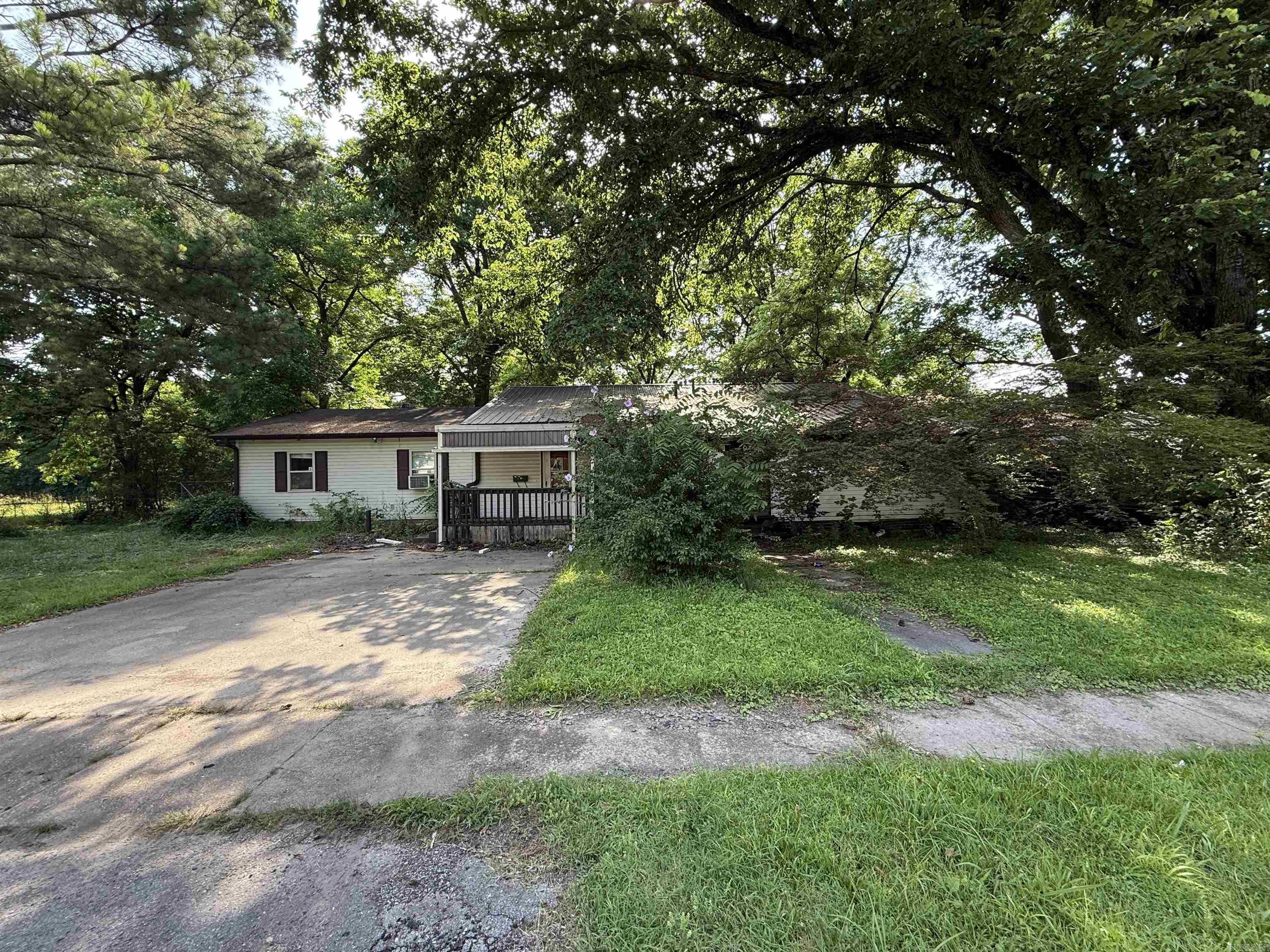 Investor Special! This spacious property in the heart of Jonesboro offers over 2,000 square feet of potential and is zoned R-3, making it an excellent candidate for a single-family renovation or rental. The home sits on a shaded lot with mature trees and a wide concrete driveway for convenient parking. With all the square footage and flexible layout, this property is ideal for investors or developers looking to bring new life to a well-located home. The lot provides privacy while still being just minutes from schools, shops, and downtown amenities. Endless possibilities—fix and flip, rental, or multi-unit conversion (subject to city approval). Whether you're building your portfolio or looking for your next project, this one is worth a look!