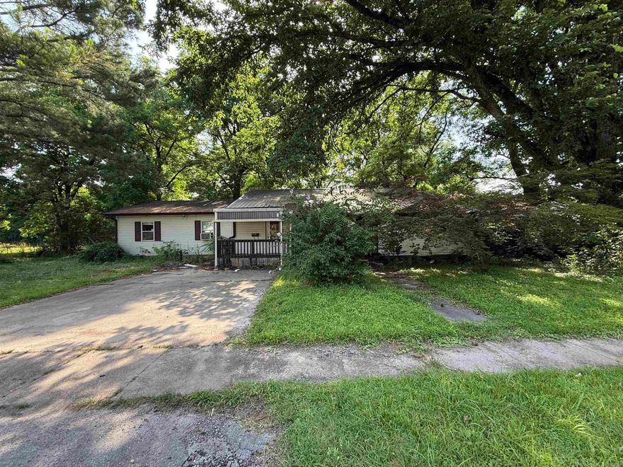 Investor Special! This spacious property in the heart of Jonesboro offers over 2,000 square feet of potential and is zoned R-3, making it an excellent candidate for a single-family renovation or rental. The home sits on a shaded lot with mature trees and a wide concrete driveway for convenient parking.  With all the square footage and flexible layout, this property is ideal for investors or developers looking to bring new life to a well-located home. The lot provides privacy while still being just minutes from schools, shops, and downtown amenities.  Endless possibilities—fix and flip, rental, or multi-unit conversion (subject to city approval).  Whether you're building your portfolio or looking for your next project, this one is worth a look!