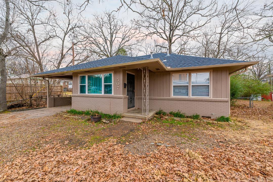 Move in ready home w/ the perfect layout, original hardwoods throughout, updated kitchen w/newer cabinets,granite counters,stainless steal appliances, laundry off kitchen w/tons of storage space, French doors leading to private deck and huge fenced in yard with large storage shed & new built in shelves, updated bath w/newer tile floors and tiled shower,granite vanities, vessel sinks and built ins,neutral paint colors,security system,newer HVAC, this house is in the perfect location walking distance to UAMS.