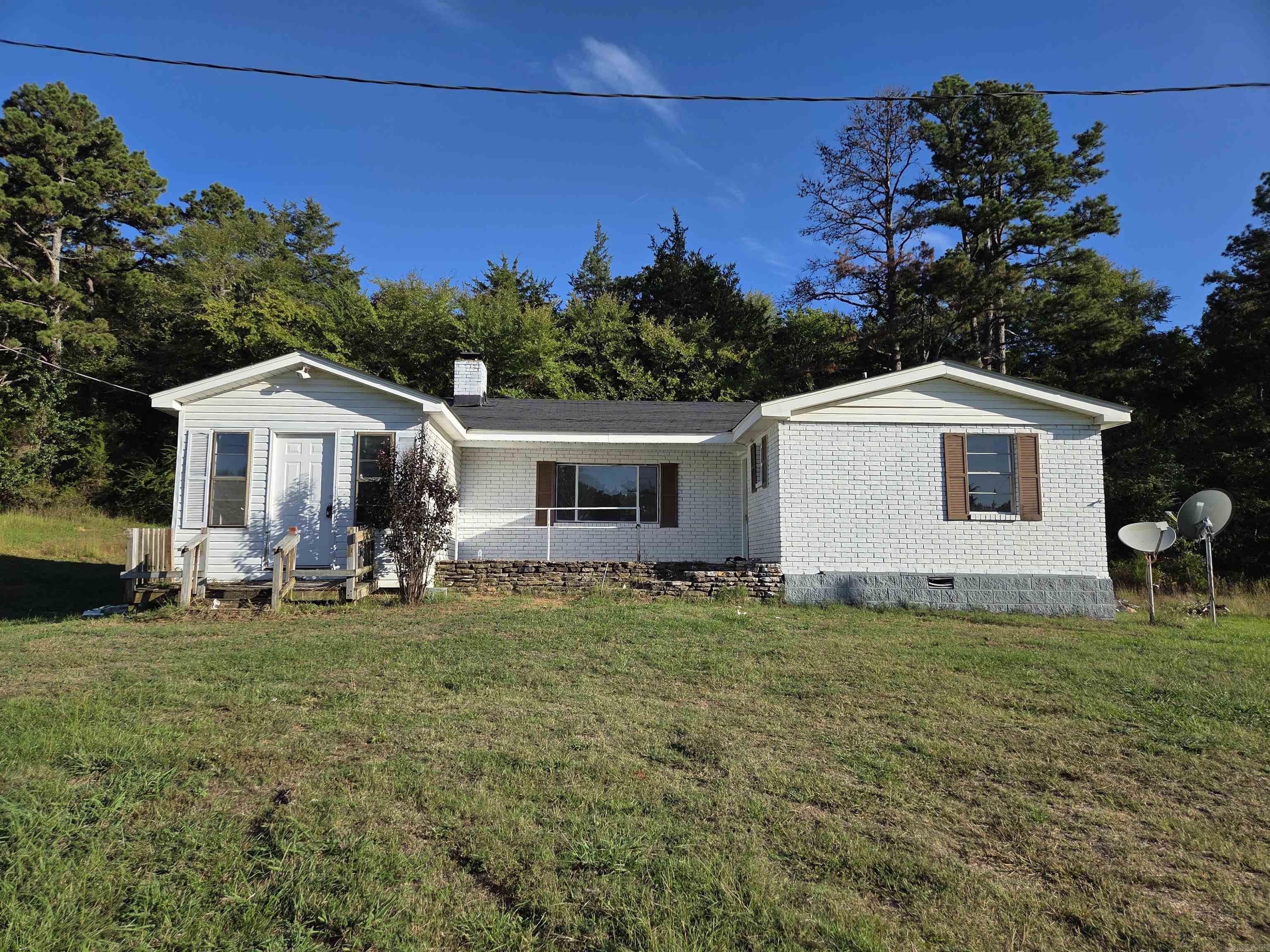 Freshly updated, this charming 3 bedroom, 1.5 bath brick home sits on 1.2 acres down a quiet private road in the Scenic Heights Addition. Built in 2012, it offers modern comfort in a peaceful rural setting while still being just minutes from Clarksville. Inside, you’ll find a bright, open layout with plenty of space for everyday living (and a bonus room!) Outside, enjoy a large open space perfect for relaxing or entertaining while surrounded by the natural beauty of the countryside. With a great balance of privacy and convenience, this home is ideal for anyone looking for a quiet retreat that’s close to schools, shopping, and town amenities!