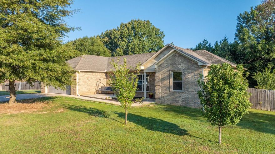 Beautiful all-brick home offering low-maintenance living on nearly an acre, complete w/mature fruit trees,fenced yard & custom chicken coop! Step inside to a spacious living area(16’8” x 16’8”)w/wide-plank laminate flooring, tray ceiling w/crown molding & abundant natural light from double windows front & back. The open-concept design flows seamlessly into the dining area & stunning kitchen w/granite countertops, a 6’ x 3’ island w/bar seating, custom cabinetry, stainless Frigidaire appliances, tile backsplash & pendant lighting. The master suite(14’ x 13’6”) offers fresh paint, crown molding & a cozy nook, a luxurious master bath featuring an 8’ double vanity,walk-in shower & a massive walk-in closet w/built-ins.A Browning 36-gun safe can also convey.Two additional bedrooms each include walk-in closets & a full hall bath.Additional highlights include:Large laundry room(7’ x 10’)w/custom cabinetry & Samsung washer/dryer(conveys), Oversized 2-car garage w/insulated doors, 12’ x 12’ front patio, 4’ x 6’ covered entry porch & 15’4” x 6’ covered back patio, Huge fenced backyard extending past the tree line, Brick mailbox & gutters.This property combines modern comfort w/country charm.