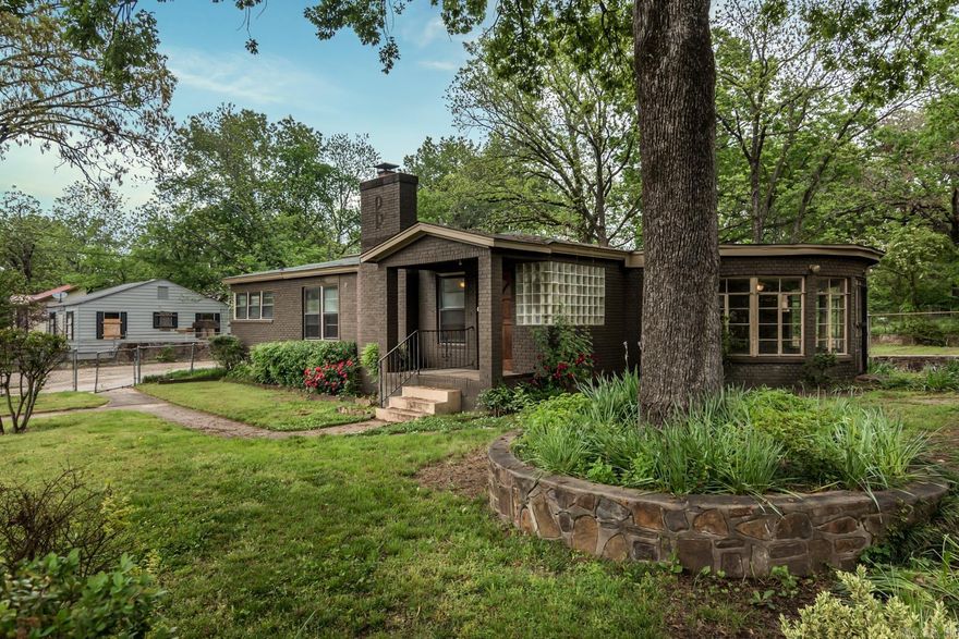 Being SOLD AS IS. OFFERING $5,000 FOR REPAIRS. Investment opportunity.  Large bedrooms upstairs and downstairs with exposed rock throughout the living area and the sun room. Fully fenced back yard.