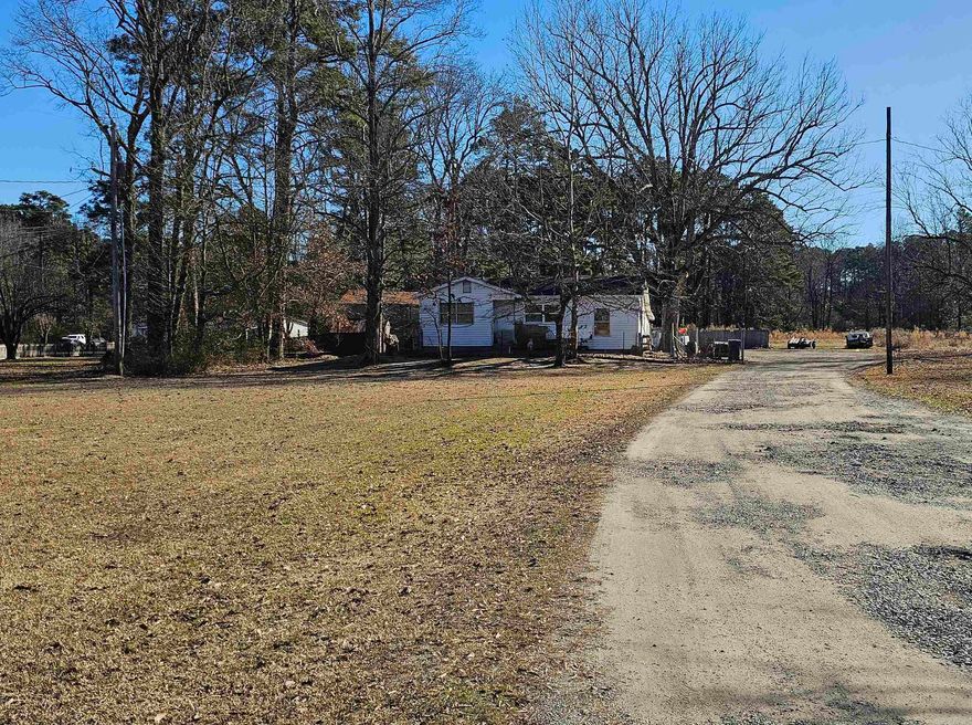Great place for investor or someone looking for a fixer upper! 2.5 acres right outside of White Hall city limits.  Property includes a 4-bed home, a large shop, and extra lot for mobile home. Back lot has additional septic tank and electric service already installed.  Call Listing agent to view property!