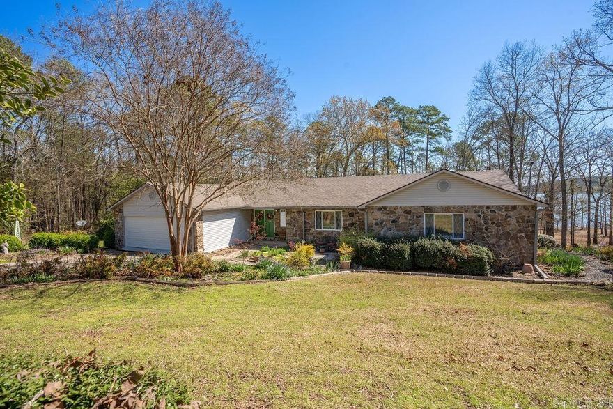 Welcome to your dream lake house on Greers Ferry Lake! This charming retreat offers 3 bd, 2 bths, and a 2-car garage, all set on a spacious 1.5-acre lot with a gentle slope down to the water. Immerse yourself in the natural beauty of the surroundings, with meticulously landscaped. Relax on the screened porch overlooking the lake, perfect for enjoying morning coffee or evening sunsets. Whether you're seeking a weekend getaway or a permanent lakeside home, this property provides the perfect blend of comfort and tranquility. Don't miss out on the opportunity to make this your own slice of paradise.