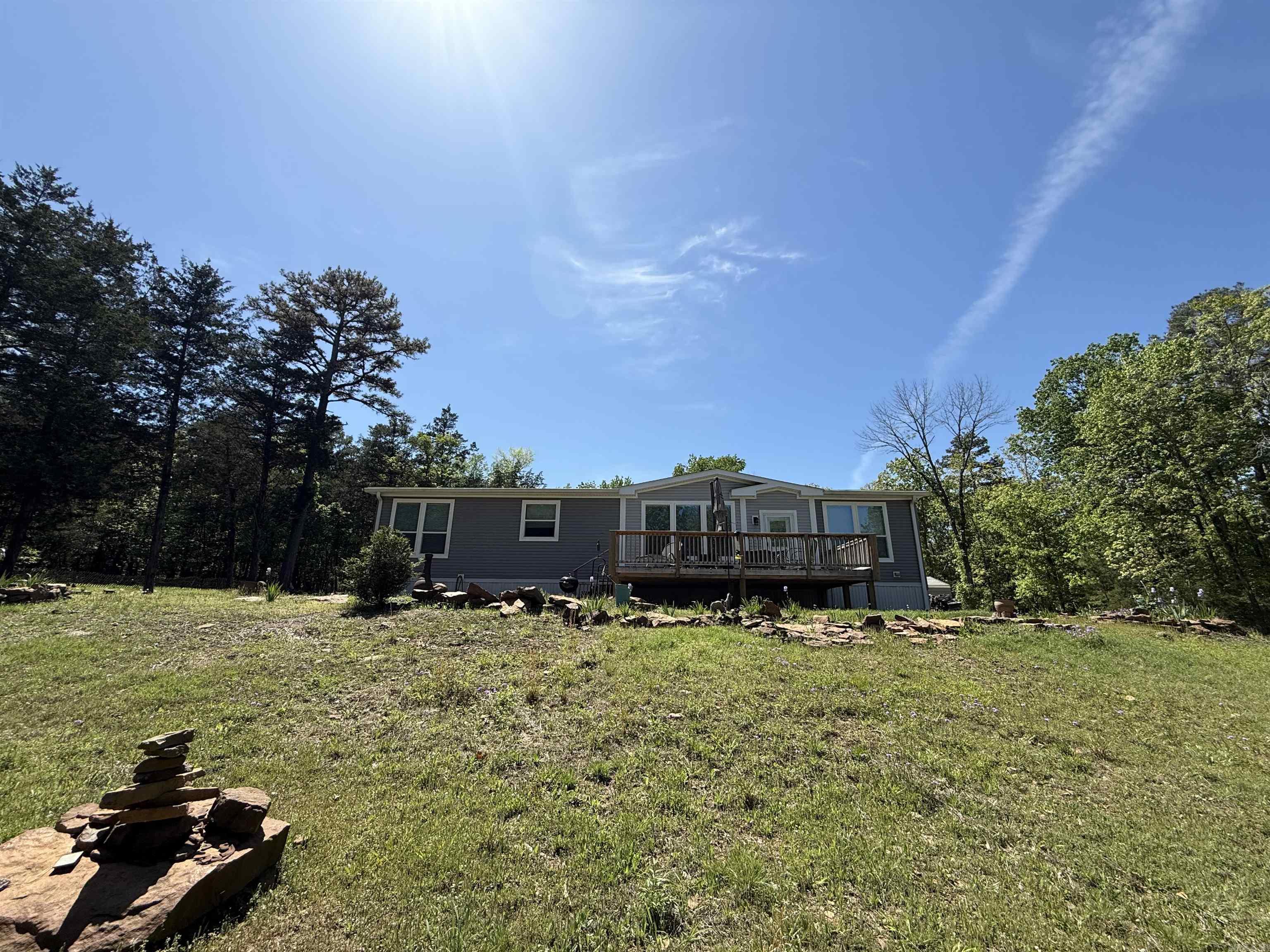 LAKEFRONT. Franklin Classic Series manufactured home on permanent foundation. Open concept with a beautiful design. Marked trail down to water with path permit (new owner will have to get permit in their name). 20x30 shop with concrete floor and roll up door.