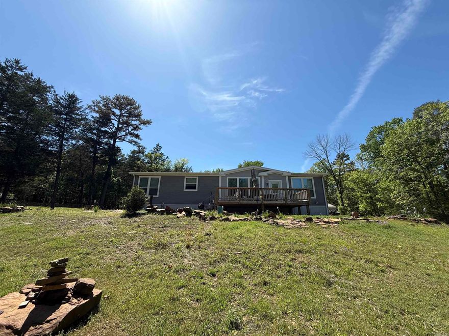 LAKEFRONT. Franklin Classic Series manufactured home on permanent foundation. Open concept with a beautiful design. Marked trail down to water with path permit (new owner will have to get permit in their name). 20x30 shop with concrete floor and roll up door.