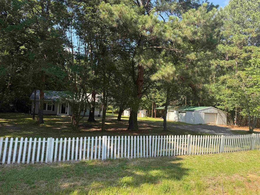 If you work from home or have need for extra space to put your toys or pets, then this is a must see. Surrounded by beautifully maintained homes. This freshly painted home has a large kitchen with an island and a 10 x 15 laundry that can serve as an office or third room. Beautiful hardwoods throughout with a welcoming enclosed porch entry leading to the kitchen &  formal dining room. Sitting on 2 Acers with a 18 x 24 shop and 24 x 36 shop with 3 garage doors as well as an added 16 x 24 enclosed lean-to. A Barn is located on the back half of the property surrounded by trees on all sides. This house has all the perks!