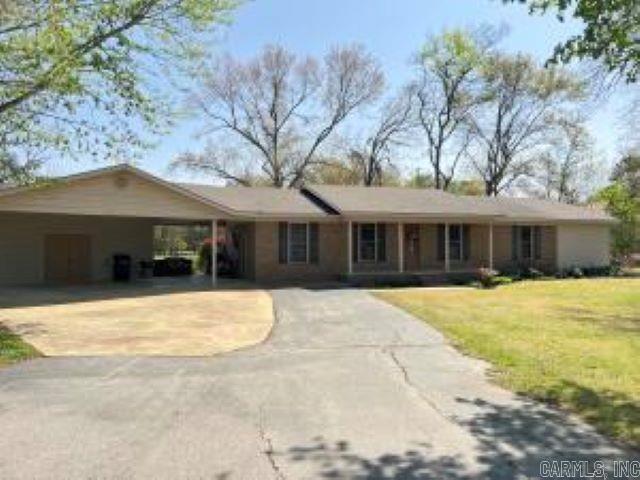 HOME SWEET HOME on 7.25 acres of land, a 30x40 shop and a FANTASTIC one-owner home! Timeless charm with the all electric 3 Bedroom/2 Bath that offers a beautiful kitchen with eating bar, Corian countertops and custom cabinets that extend in through the laundry room provided excellent storage. The hall bathroom is large & has a beautiful custom tiled walk in shower. A beautiful owner's suite was added in 2020 which has a bedroom with enough space for a sitting area, large walk-in closet and a spacious bathroom with walk-in tiled shower and a separate jetted bathtub. Under the attached oversized double carport is built in 4x8 storm cellar so access is easy & covered. At the back is a concrete patio and 2 nice storage buildings. The 30x40 shop has 2 overhead doors & a 10' wide lean to.