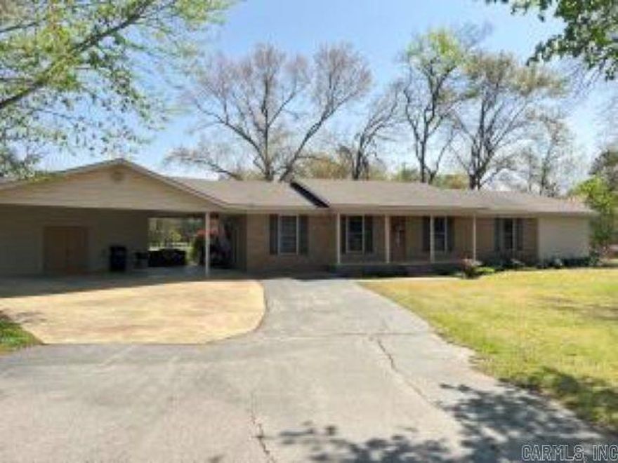 HOME SWEET HOME on 7.25 acres of land, a 30x40 shop and a FANTASTIC one-owner home! Timeless charm with the all electric 3 Bedroom/2 Bath that offers a beautiful kitchen with eating bar, Corian countertops and custom cabinets that extend in through the laundry room provided excellent storage. The hall bathroom is large & has a beautiful custom tiled walk in shower. A beautiful owner's suite was added in 2020 which has a bedroom with enough space for a sitting area, large walk-in closet and a spacious bathroom with walk-in tiled shower and a separate jetted bathtub. Under the attached oversized double carport is built in 4x8 storm cellar so access is easy & covered. At the back is a concrete patio and 2 nice storage buildings. The 30x40 shop has 2 overhead doors & a 10' wide lean to.