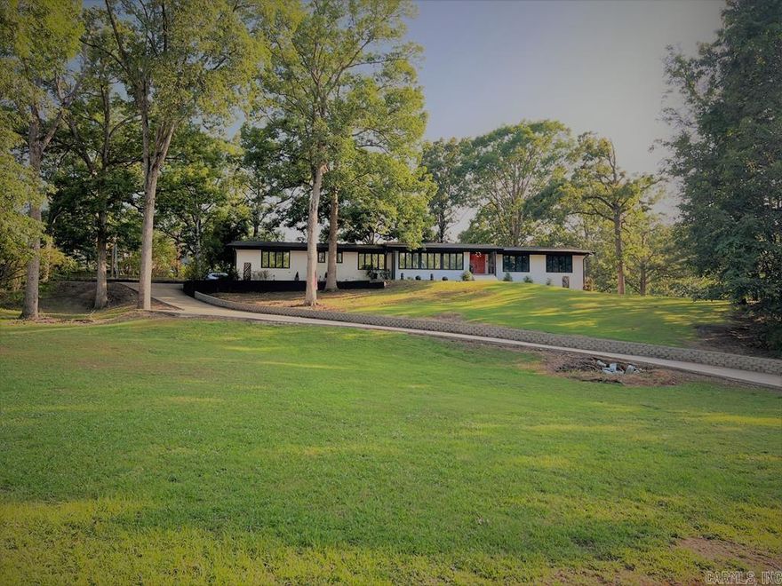 Modern Style Meets Classic Charm on Wynnewood! Perched high on the ridge in the prestigious Wynnewood Addition, this stunning mid-century ranch offers the perfect blend of space, style, and updates throughout. With 5 spacious bedrooms, 3 fully renovated bathrooms, and 3 separate living areas, this home was designed to impress. A brand-new driveway and retaining wall lead to a bold white brick exterior accented in rich dark tones, creating unforgettable curb appeal. Inside, the updated kitchen is a showstopper—featuring quartz countertops, custom shaker cabinetry, and an open flow perfect for entertaining. New luxury flooring and fresh designer paint extend throughout the home. Two of the bedrooms are en-suite, offering privacy and convenience, and every bathroom has been thoughtfully remodeled with chic, modern finishes. A heated and cooled sunroom opens to a large deck, ideal for indoor-outdoor living and year-round enjoyment. The partial unfinished basement adds generous storage space and doubles as a storm shelter. The 2-car garage has brand-new doors, and every detail has been considered in making this home both stylish and functional. Call today to experience in person