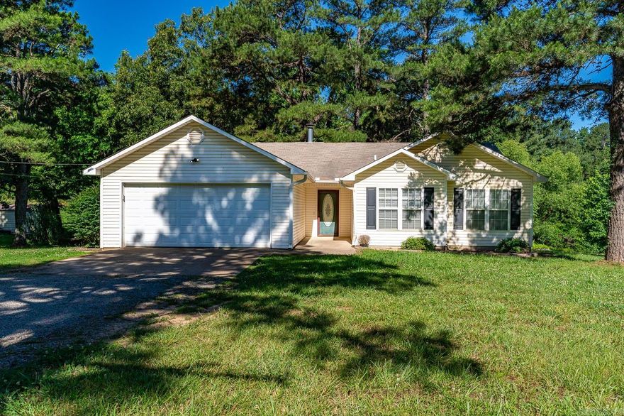 Welcome to Market 115 County Road 799 of the Coggins Subdivision in Jonesboro, Arkansas within the Brookland School District. This all electric property has it all!  Situated on a 1.20 +/- acre lot is a three bedroom, two bath, 1,139 sf Ranchette wrapped in vinyl and accented by shutters and a beautiful front door. Step inside and into the living room with vaulted ceiling and cozy wood burning fireplace. The eat-in kitchen offers, bar seating, pantry, and access to the wood deck. The living quarters hold a Master bedroom with walk-in closet, and an ensuite that includes a jet tub and walk-in shower, two spare bedrooms, full spare bathroom, and laundry closet. The exterior features gorgeous tree lined views, a wired and floored 30 x 40 shop with separate driveway, and bonfire pit. Experience country charm conveniently located near Highway 351. Hot off the press, priced to sell, and move in ready. Call today to make this house your home.