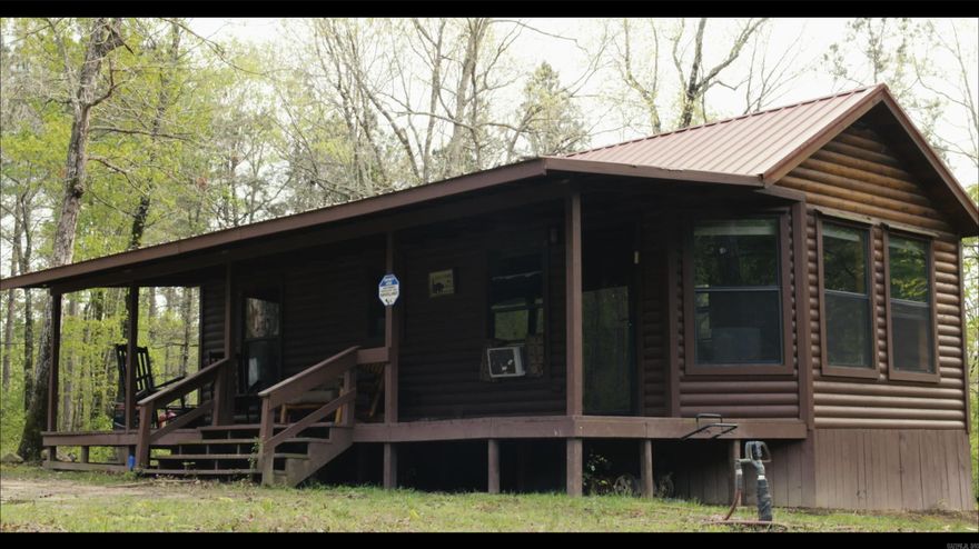 30 Breathtaking Acres nestled in the most private of locations surrounded on three sides of Ouachita National Forest! This is a homesteaders dream and completly off the Grid!  This immaculate, Amish-built cozy cabin comes complete with Solar Panels and Generator.  You have to see it in person to appreciate the serene beauty and solitude this property offers!  The Mountain Views, sounds of flowing Shack Creek and the diverse wildlife on this property all give it a peacefulness that is unparreled to any other!  Come take a look yourself and imagine the quiet, dark nights and crisp mornings on the porch while you sip your coffee or tea! Be sure to see the attached VIDEO for a preview!  More pictures to come.