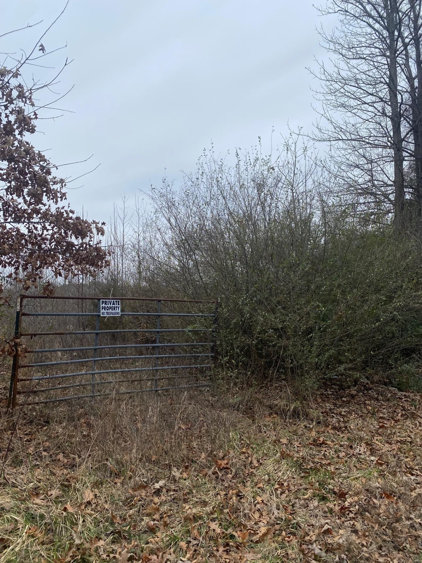 Posted, fenced/shared fencing. Status of road, and county maintenance to be verified.