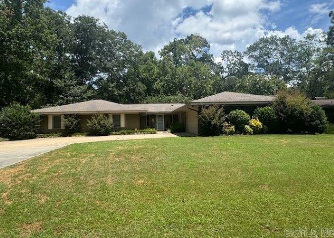 This beautiful 4 bedroom, 3 bath home offers 2620sf, built in 1974. Great location off the high traffic areas. All spacious rooms including the kitchen with long work island with room for bar stools and storage, tile countertops, electric stove and abundant cabinets and leads to the formal dining room. Spacious living room with a convenient electric fireplace and long hearth will be perfect for holiday gatherings. 3 Bedrooms share 2 hall baths, while the primary bedroom has its own bath with jetted tub, separate shower and makeup area. A delightful covered patio in the fenced backyard is perfect for relaxation and watching the kids play outside. A separate storage building is also included. New sewer lines placed in 2025. Two water heaters; one gas, one electric. HVAC is gas, age unknown. Sellers are willing to replace the roof with an acceptable offer. Call for your appointment today! Some pictures shown are from when it was occupied. Agents see showing remarks.