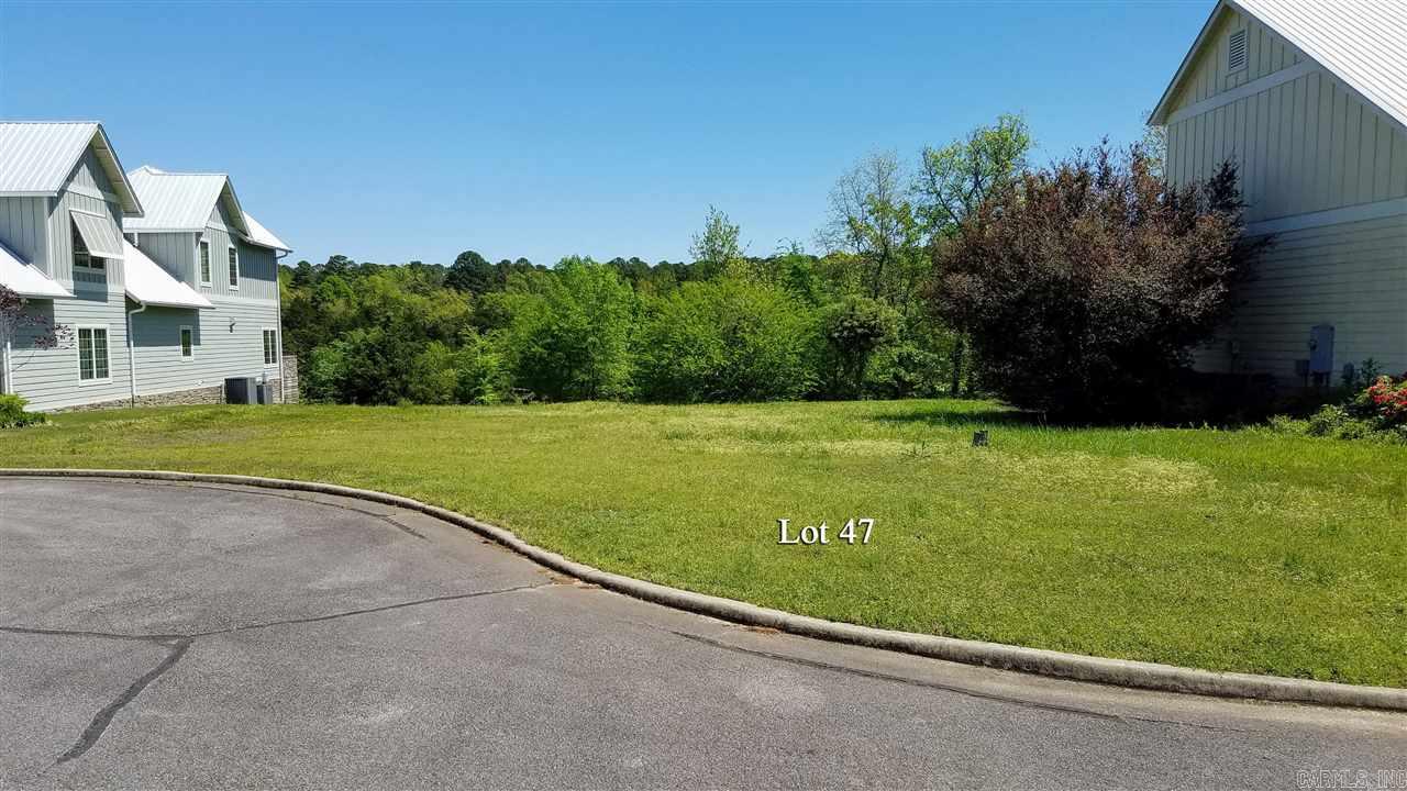 Lake front lot on a quiet cul-de-sac in a private gated community that features distinctive homes, park area, and community pool. Only 1.4 miles to Dam Site Marina.