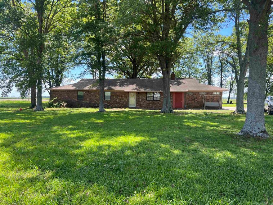 Beautifully maintained three bed two bath home on a spacious 1.82 shady acre lot.  The master suite has a wonderful walk in closet that spans the length of the bedroom, the large living room is perfect for entertaining and has a woodburning fireplace with blowers, separate laundry room with office attached with additional storage, and the kitchen is perfect for the chef in the house.  Don't miss this excellent opportunity!