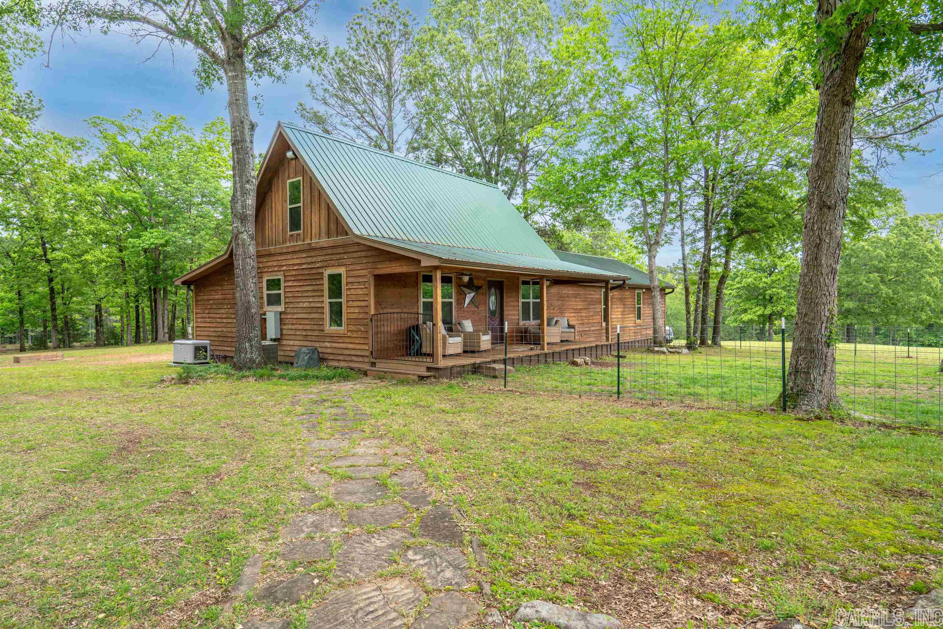 88 Acres with Corp of Engineers property on three sides. 3 ponds wooded hunting land and pasture land. Jest a short walk to Lower Lake DeGray. 2 homes 1st home is 2 bedroom 2 bath with 1860 sqft built in 1999 2nd home is a 2 bedroom 2 bath 2013 Mobile Home with 896 sqft. First building is 79x51 wood framed building big enough for an RV and several cars. On the upstairs is an 51x33 area famed in for an 1680 sqft 3 bedroom 3 bath Living area. It Has spray foam insulation. Equipment shed is 38x26 with covered porch and Hot Tub. Other building is 58x38 metal building with bar and bathroom. It also has a attached 55x16 garage and 50x20 lean to. Arkadelphia school district. Property is on City water. It also has internet available. Generac generator in main home and wood stove in party building and storm shelter. Do Not convey. New Heat & Air in main house installed May of 2023