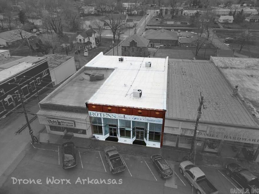 In the center square of the town of Marshall, this commercial building gets high traffic and visibility being close to the Post Office, across from the County Courthouse, as well as the Assessor's office, Clerk's office, MVD, and more. With large windows across the front, any business conducted within, or merchandise for sale would be easily visible from outside to attract customers.  Most of the building space is at street level, yet it has a to more retail or office space with the upper and lower levels at the back.  There is plenty of additional storage space toward the back with closets and a basement room to house merchandise, supplies, and more.    For dinners and shows, Branson, MO is just a quick drive north on the busy Hwy 65, passing through Harrison, AR where there is a community college and regional hospital.  To the south is Clinton, AR, also having their own hospital.  Marshall is a beautiful place to live, with wonderful residents having a hometown feel, comparatively low property taxes, and some of the most beautiful scenery imaginable.