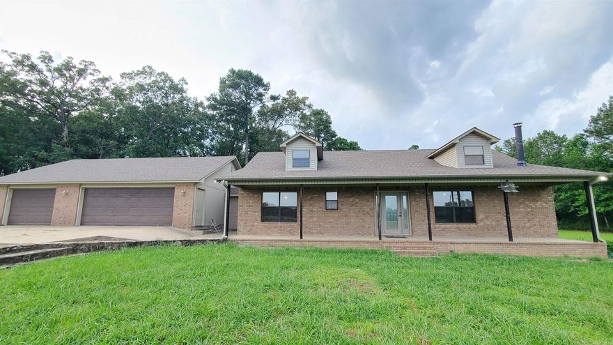 Call this one Home, Very unique custom built home. Home orginally built in 2002 consisted of a Large Open LR/Kitchen/Dinning Area with Lots of Windows for amazing nautrual light. Beautiful wood Kitchen Cabinets for lots of Storage, Wall oven, Cooktop Stove Corner Sink to look out over the property and a lage Breakfast Bar area makes this a great home to entertain in. It also Has a large Master Bedroom/Closet with a Great Master Bath with Large walk in Tile Shower and Double Sink Vanity. Nice Laundry Room that also houses the Water Heater/ HVAC for the main home Along with a Bonus Rm Great for an office or could be a bedroom and a nice 2nd Bath. Then... An addition was done around 2017 inside the garage adding a Great Kids Space/Mother in law or Rental adding another small LR, Kitchenette, Full Bath with Shower and 2 more Bedrooms.  This 5 Beautiful Acres also has a nice Storage Building, Brand New Deck, and a large 30 x 50 shop with its own driveway.  Agents see remarks for showing instructions and additional info.