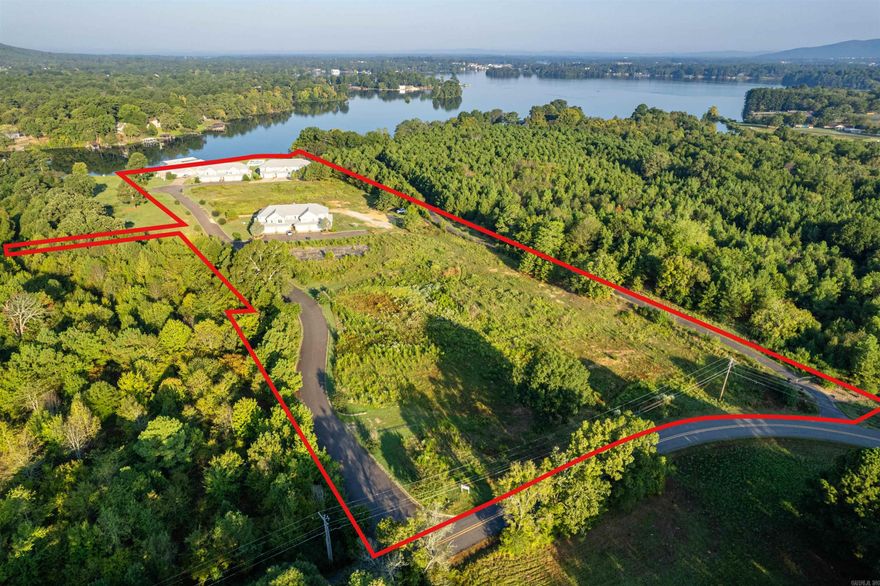 Seize this exceptional investment opportunity to unlock the full potential of prime vacant land at the Blue Heron Condo Complex. Perfectly positioned for visionary investors, this property boasts level lake frontage and a swim dock on the stunning Lake Hamilton, ideal for outdoor enthusiasts. With the ability to subdivide into 10 lots and the potential to build an additional 40 condos, the possibilities for development are limitless. Enjoy outstanding amenities, including a sparkling inground pool and expansive green spaces for relaxation. This property is perfectly suited for tapping into the booming short-term rental market, allowing you to build and own your own VRBOs. Additionally, the seller holds a majority interest in the Property Owners Association, providing valuable influence in future community decisions. Don’t miss this extraordinary chance to shape the future of a thriving community—invest in your vision today!