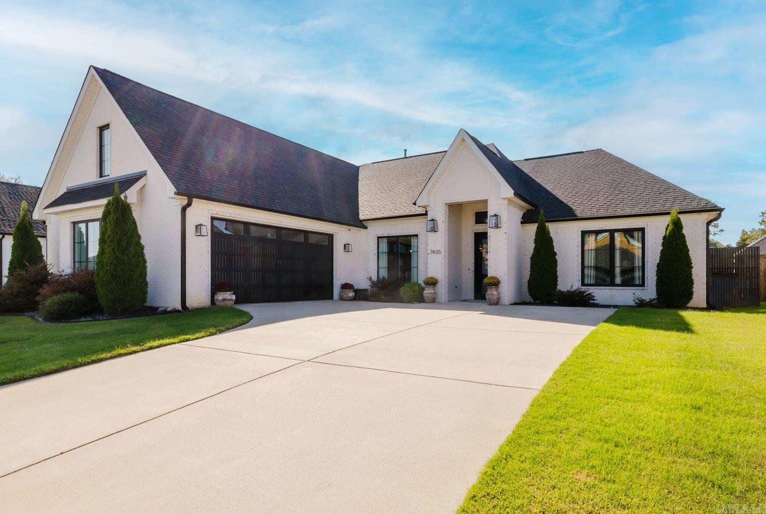 Peaceful tranquility meets modern luxury! Step through a custom iron front door into this beautifully updated 3-bedroom plus an upstairs bonus, 3-full-bath home designed for both comfort and elegance. Enjoy updated light fixtures and hardware, new flooring in most bedrooms, and an upgraded kitchen island countertop that makes entertaining effortless. The primary suite offers a serene retreat featuring a spa-inspired bathroom with a freestanding soaking tub, walk-in shower with a rain shower head. Upstairs, a bonus room with a full bath provides flexibility as a 4th bedroom, guest suite, playroom, or private retreat. The screened-in back porch with a fireplace creates the perfect space for year-round relaxation. A deep two-car garage offers generous storage. Every detail in this home has been carefully curated to combine modern luxury with peaceful living in one of Benton’s most desirable neighborhoods.