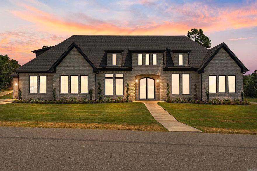 Welcome to your dream home in Benton, Arkansas, nestled within the highly sought-after Benton School District. This stunning luxury property boasts four spacious bedrooms and 3-1/2 beautifully appointed baths, all set on a generous 2-acre lot. As you step inside, you are greeted by an inviting open concept floor plan that seamlessly blends elegance and comfort. The living room exudes warmth with its exquisite wood beams and a gas log fireplace complete with a custom mantle, complemented by large picture windows that flood the space with natural light. The chef's kitchen is a culinary delight, featuring a sprawling quartz island, custom cabinetry, and a hidden walk-in pantry that provides both style and functionality. Retreat to the luxurious owner suite, which offers a vaulted ceiling that adds to the spacious feel. The owner's bathroom is a true oasis, showcasing a freestanding soaker tub and a large custom tile shower for the ultimate relaxation experience. Additional highlights include a dedicated office space, a three-car garage, and a large covered back porch with a cozy wood-burning fireplace, ideal for entertaining or enjoying peaceful evenings. Make this home yours today!