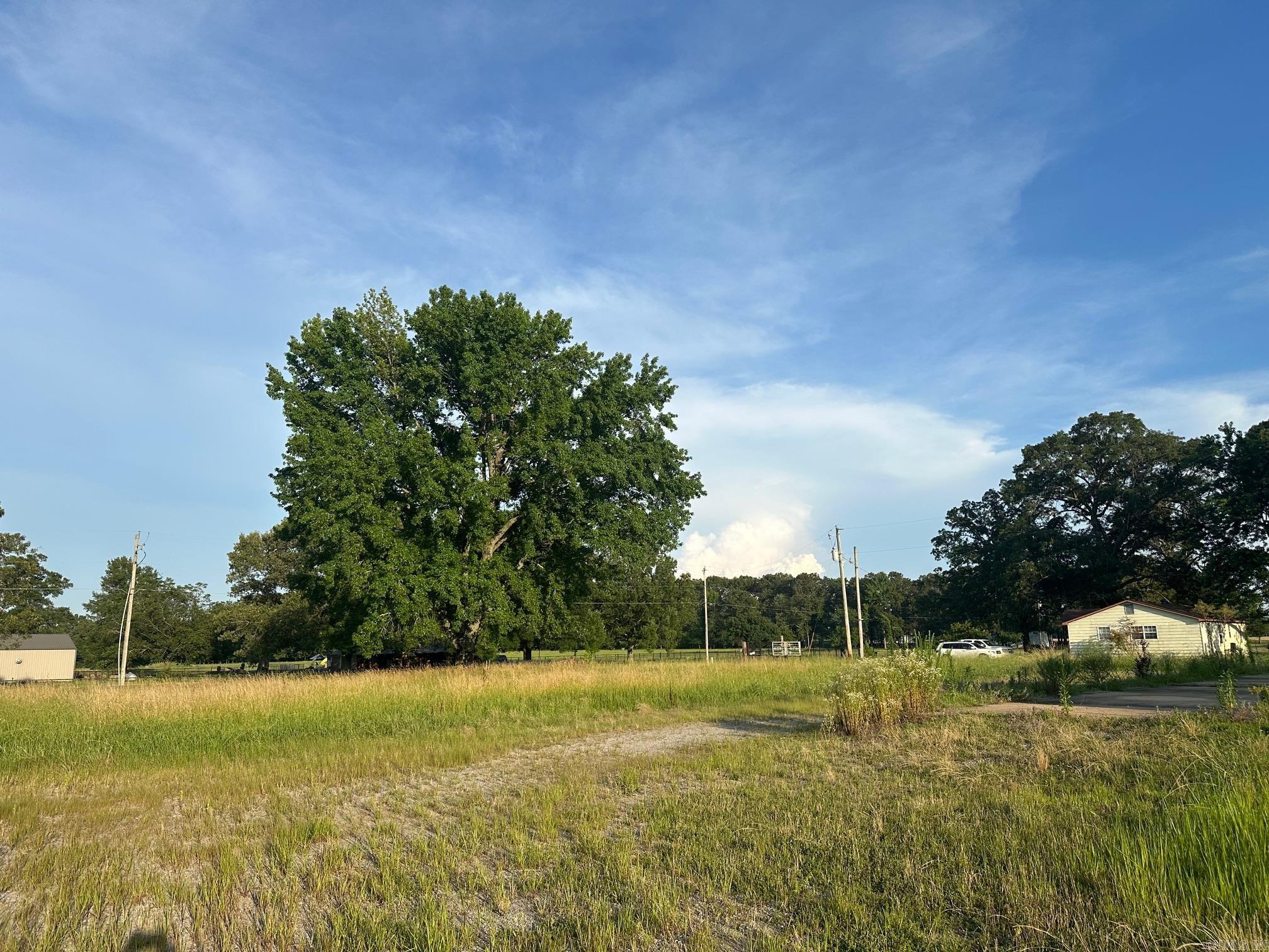 The property includes 14.63 level acres and a large warehouse plus a 600 sq ft storage building. The warehouse offers endless possibilities with 4 overhead doors, an office area, and a partially finished 400 sq ft loft—perfect for additional storage or a bonus area. An additional 1,600 sq ft has been added to the original structure, providing even more room to grow your business or operations. Property is being sold as is, and some contents will be removed prior to closing. The owner was in the process of remodeling and never finished. A great opportunity for investors or anyone needing substantial space with convenient access. Contact us today for details or to schedule a private showing! Sqft approximate, please measure.