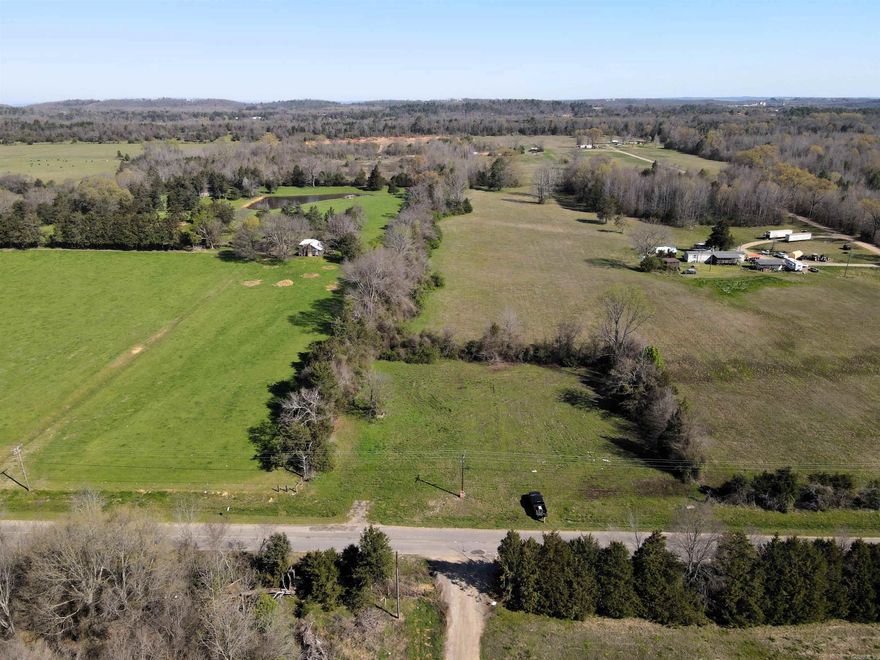 - 10 +/- acres  - Numerous build sites - Mostly pasture - Utilities on the property - Recent survey - Partially fenced - Paved road frontage  - No restrictions - Outside city limits - 5 miles to Interstate 40 - 4 miles to Morrilton