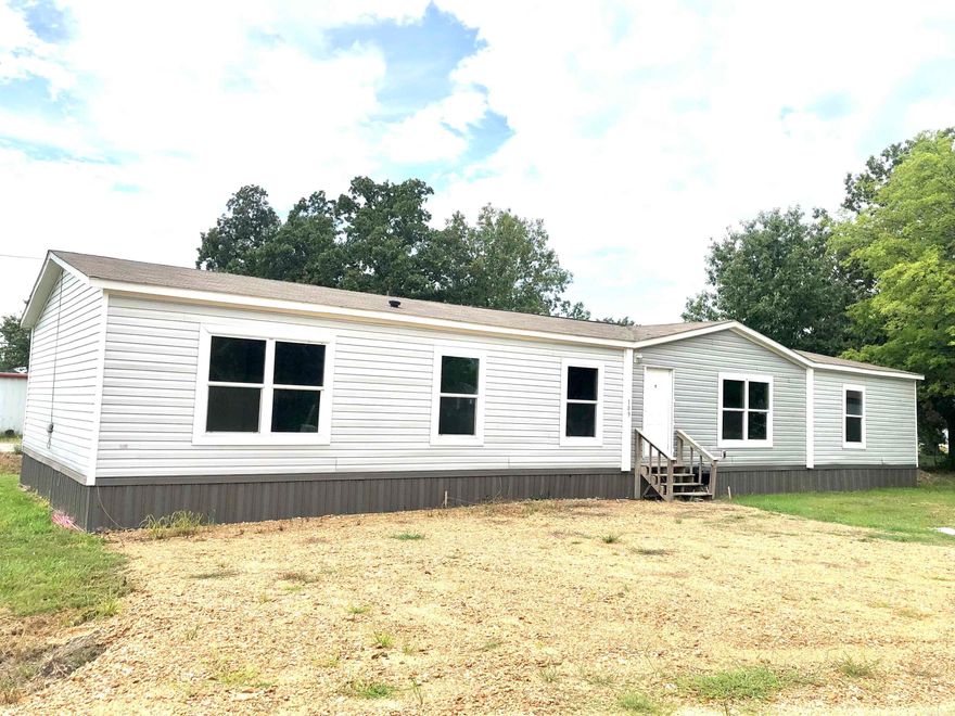 Nestled in Delaplaine, this 2018 CMH manufactured home boasts 2128 sqft of modern comfort. With 4 beds, 2 baths, an open layout, and split bedrooms, it's designed for both relaxation and entertainment.  The primary bedroom features a spa-like en-suite with a walk-in shower, garden tub, and double vanities. A convenient mudroom and spacious pantry enhance daily living. Plus, recent upgrades include a new septic, water meter, and electric pole.  Located in a duck hunting haven, yet just 20 minutes from Paragould and Walnut Ridge, this property blends rural tranquility with urban convenience—a perfect retreat for modern living in a picturesque setting. No Sellers Disclosure