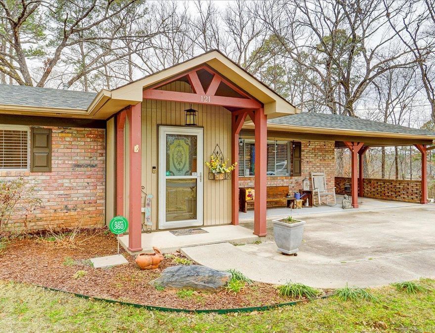 Spacious 5-bedroom, 3-bath home with 3,097 total heated square feet (1,717 sqft upstairs and 1,380 sqft finished downstairs), located just two blocks from Lake Hamilton access.  Upstairs includes a bright living room, two dining areas, and a kitchen with stainless steel appliances, double ovens, and brick accents. Three bedrooms are on the main level, including one with an en suite bath.  The lower level features a large primary suite with a tray ceiling, oversized walk-in closet, and bathroom with jetted tub and walk-in shower, plus an additional bedroom.  Outdoor features include a second-level deck, a covered patio, and a detached storage building that can be used as a workshop, office, or studio.  Located on a wooded lot in a quiet neighborhood with seasonal lake views.  Agents – Call ShowingTime to schedule all showings.