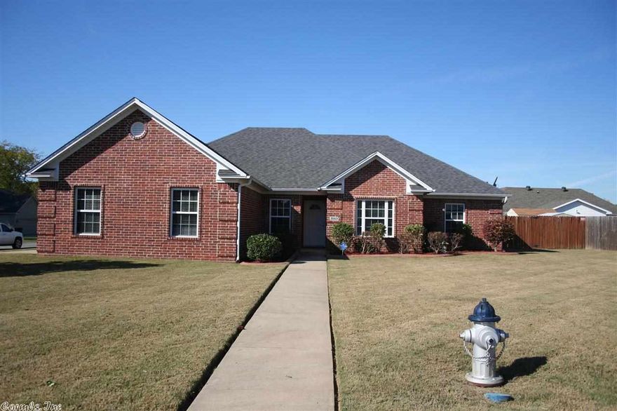 WOW! A 4 bedroom, 3 bath home with the possibility of 2 masters!  This house has FRESH PAINT, laminate floors, an open floor plan, a small office, & some handicap accessibly features in the bathrooms.  The house sits on a large corner lot with a side load garage.  There is a large kitchen that has an island.  The living room has a fireplace, 11 ft. ceiling, & a nice view into the backyard.  The master bedroom is very large with a tray ceiling.  This is a must see house!  This house qualifies for RD!